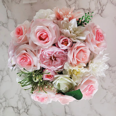 Nestled inside this delicately crafted handmade flower hat box lies a bouquet in shades of pink and white, a perfect gift for an anniversary celebration. The soft hues of the flowers exude elegance and charm, making it an ideal token of love and appreciation. This personalised creation conveys thoughtfulness and care, adding a special touch to the occasion