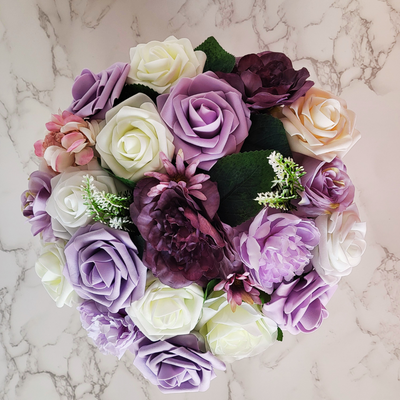 Nestled within a charming White and gold hat box lies a blooming treasure – the Personalised Name and Age White and Purple Flower Hat Box. This captivating Birthday Gift Box is a delightful Floral Arrangement that serves as a customised Birthday Keepsake, perfect for a surprising and delightful Gift For Her. 