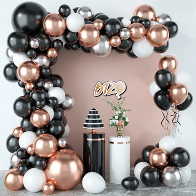 Create a stunning atmosphere for any occasion with our Double Layered Black and White Balloons with Metallic Rose Gold Party Balloon Arch. Whether it's for summer parties, graduations, weddings, birthdays, Valentine day, baby showers, festivals, anniversaries, or other special celebrations, this visually stunning arch will add the perfect touch. 
