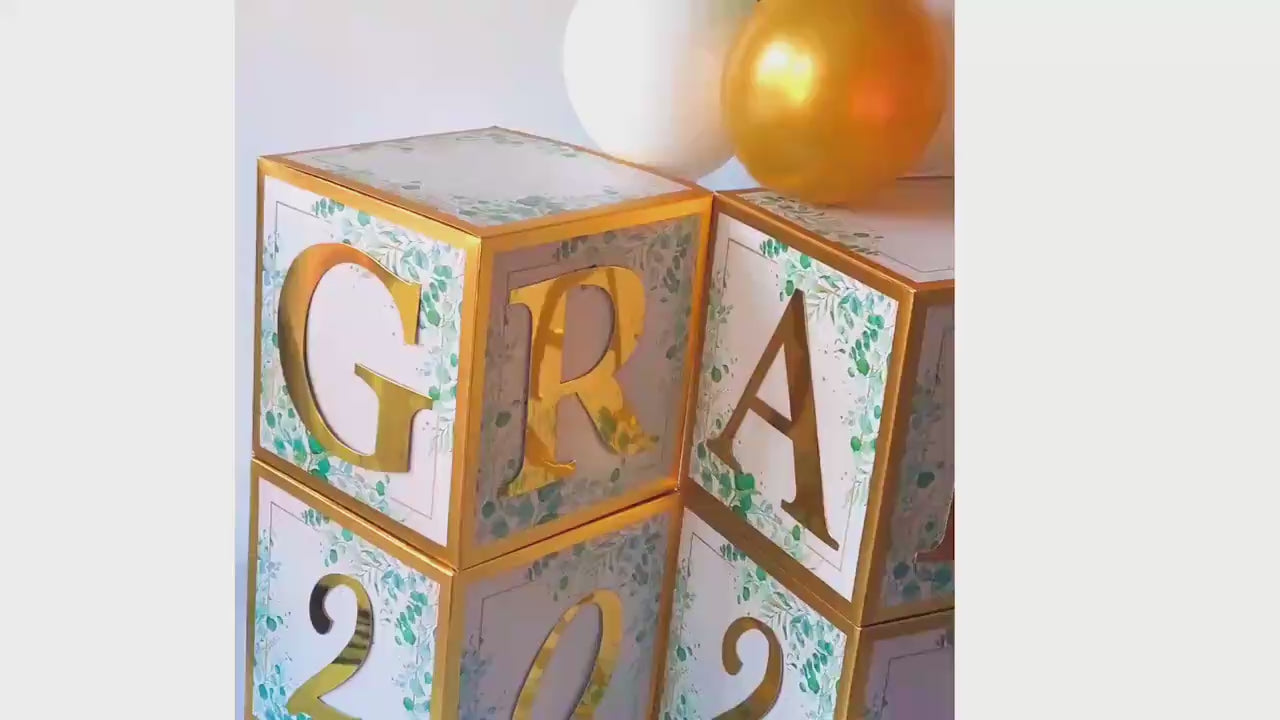 Create a sophisticated and timeless look for your graduation celebration with these elegant sage green blocks. The gold foil letters add an elevated touch that complements any party theme. Use them on their own, with other decorations, or as photo backdrops.